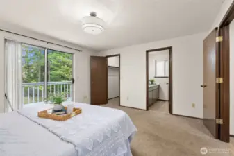 Primary with ensuite bath and walk-in closet.