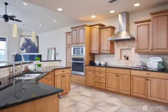 Large kitchen with granite and gas cook top & built in wall oven