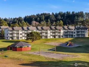 Community gazebo with BBQ, beach volleyball court, and playground.