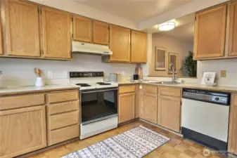 The kitchen is spacious with lots of counters.