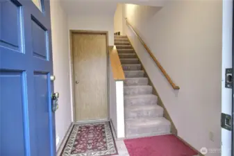 The entry going upstairs as well as to the garage.