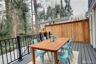 The deck is large with a peaceful view of the greenspace.