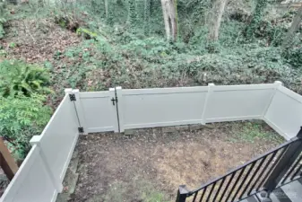 From upstairs, the view of the fenced yard.