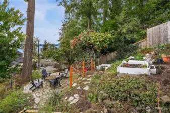 Lower level patio is perfectly situated to gather and immerse in the surrounding nature.