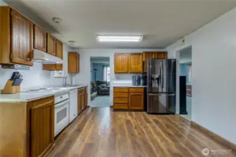 Large kitchen with new quartz countertops and updated flooring