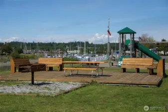 one of several playgrounds and park benches