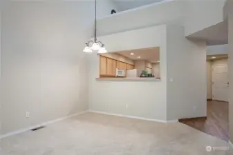 Dining room has large pass-through window to kitchen