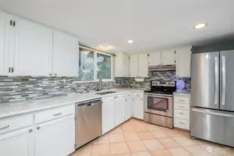 Large updated kitchen, all appliances stay.