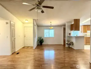 View of inside of entrance, dining area, and kitchen.