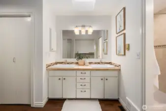 The primary suite bathroom has a walk through closet and 3/4 bath with walk-in shower