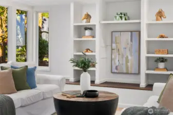 The lovely Rec room/bonus room on the lower level has custom built-ins with a private entry to the outside