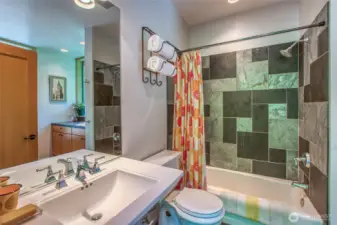 The second full bathroom is connected to a convenient laundry space.