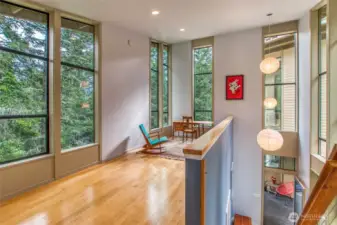The loft feels like a treehouse with sunlight pouring in.