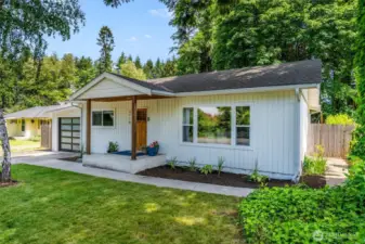 Home features welcoming covered front porch