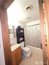 Full bathroom with newer ceramic tile