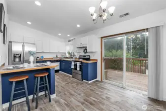 Slider leads to deck off kitchen.