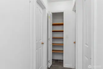 Upstairs hallway with linen closet.
