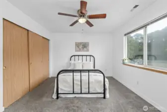 Primary bedroom with extended closet.