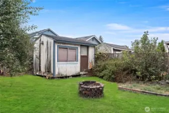 Fire pit and garden shed.