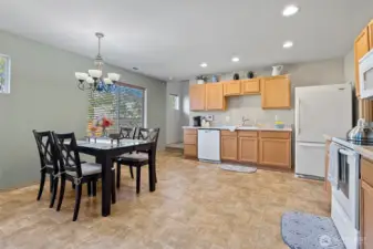 Spacious kitchen with eating spaces and a slider to your fenced backyard.