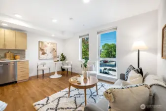 Bright live, work area that lives bigger with high ceilings. Hard wood floors throughout.