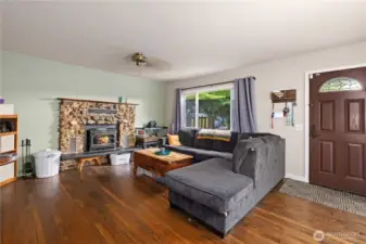Cozy & inviting living room. Hardwood floors add warmth and character.