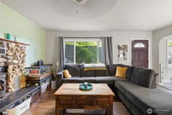 Cozy & inviting living room. Great natural light from large windows.