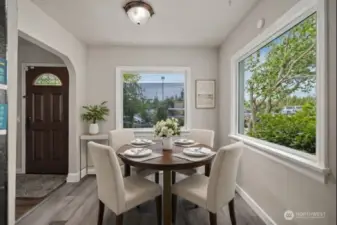 Dedicated dining room is light & bright thanks to large windows. Virtually staged.