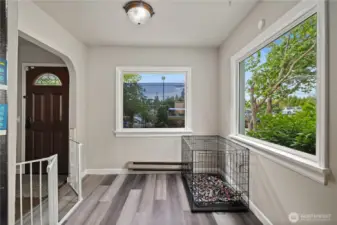 Dedicated dining room is light & bright thanks to large windows. Versatile space could become an office or playroom, tons of potential.