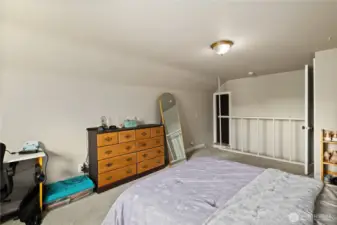 Spacious primary bedroom with fresh paint.