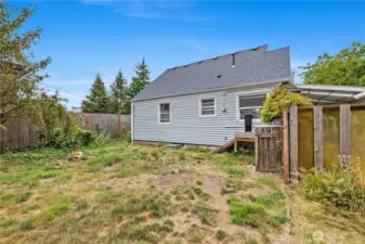 Private backyard with fire pit area. Could be home to future BBQs hosting family and friends.