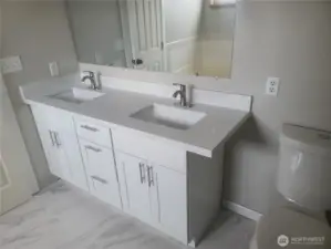 Primary bath showing new double vanity