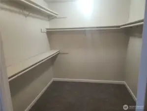 Large primary bedroom walk in closet