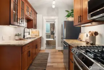 Updated mission-style cabinets, granite counters, stainless appliances and new gas range.