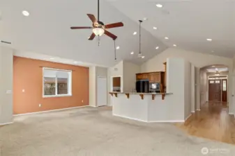 Looking from living room towards kitchen and front entry.