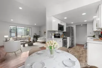dining area leading to kitchen and living area