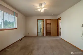 Primary bedroom with 3/4 bath and walk in closet