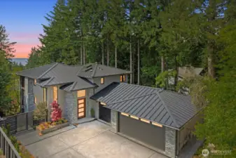 Complemented by a 924 SF three-car garage with heated floors, skylights, and versatile flex space—engineered for future expansion with full-stack plumbing and structural beams already in place.
