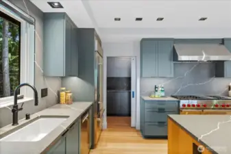 Designed for entertaining and multi-generational living, dual gourmet kitchens on the main and lower levels feature a $120K collection of Sub-Zero, Wolf, Bosch, Zephyr, and LG appliances—ensuring effortless hosting on any scale.