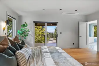 Primary bedroom retreat has its own covered & heated balcony