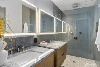 From designer tilework to Robern cabinetry and Kohler fixtures, every bath reflects thoughtful luxury and timeless design.