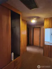 Entrance to 3 bedrooms and full bath, off Entry, with built in for added storage