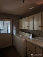 Laundry and Utility rm with ample storage. Washer and Dryer stay with home.