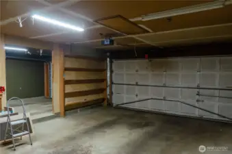 The two garage spaces flow together nicely with just a step separating them.