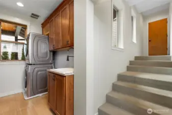 Laundry area with tons of storage and access to the garage and ADU