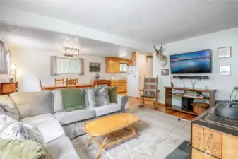 Open-concept living room, dining room, and kitchen provides great flow and is ideal for entertaining.