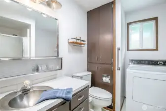 Water heater is located behind the lower wall cabinet.