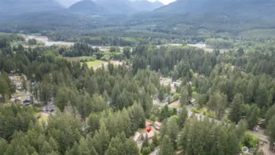 Expansive aerial view of Packwood and the surrounding valley—nestled between mountains and rivers, this is the quintessential Pacific Northwest mountain town.