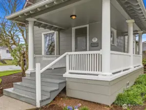The wrap around covered front porch invites you to sit and enjoy the fresh morning air and greet strolling neighbors.