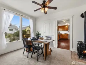 The dining room features very large windows, a ceiling fan, the gas stove and the original built-in china storage. The original moldings, doors, and hardware throughout the home are beautiful.